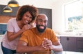 Portrait Of Smiling African American Adult Son With Mother In Kitchen At Home Royalty Free Stock Photo