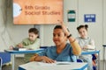 Excited Boy Raising Hand in Class Royalty Free Stock Photo