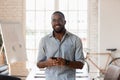 Portrait of smiling african American businessman posing in office Royalty Free Stock Photo