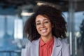 Portrait of a smiling African American businesswoman sitting in the office facing the camera and smiling. Close-up photo Royalty Free Stock Photo