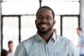 Portrait of smiling african American employee posing in office Royalty Free Stock Photo