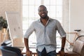 Portrait of smiling african American employee posing in office Royalty Free Stock Photo