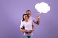 Smiling pregnant black woman and man with speech bubble Royalty Free Stock Photo