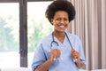 Portrait of smiling african american mid adult female doctor with stethoscope in hospital Royalty Free Stock Photo