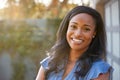 Portrait Of Smiling African American Woman In Garden At Home Against Flaring Sun Royalty Free Stock Photo