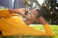 Smiling african american woman talking with mobile phone in park Royalty Free Stock Photo