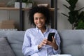 Portrait of smiling African American woman use cellphone Royalty Free Stock Photo