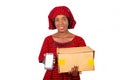 Portrait of smiling african woman holding a delivery carton and