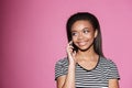 Portrait of a smiling african woman talking on mobile phone Royalty Free Stock Photo