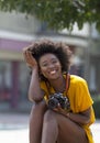 A portrait of a smiling Afro young lady.