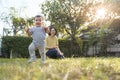 Portrait of Smiling Asian Little child son and his young mother in nature with sunlight, Happy family home Royalty Free Stock Photo