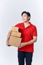 Portrait smiling Asian man holding post boxes standing over isolated background with copy space Royalty Free Stock Photo