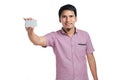 Portrait of smiling Asian man holding white blank business card Royalty Free Stock Photo