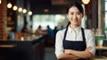 portrait of smiling asian waitress in apron standing at cafe Generative AI Royalty Free Stock Photo