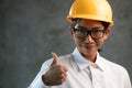 Portrait of smiling Asian woman engineer showing thumbs up gesture Royalty Free Stock Photo
