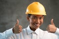 Portrait of smiling Asian woman engineer showing thumbs up gesture Royalty Free Stock Photo