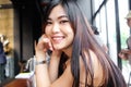 Portrait of smiling asian women sitting in loft cafe