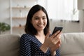 Portrait of smiling Asian woman using smartphone Royalty Free Stock Photo