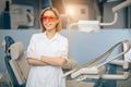 Portrait of smiling attractive dentist in clinic Royalty Free Stock Photo