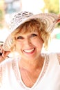 Portrait of smiling attractive elegant senior lady in hat. Royalty Free Stock Photo