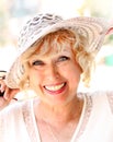 Portrait of smiling attractive elegant senior lady in hat. Royalty Free Stock Photo