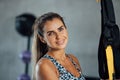 Portrait of smiling attractive sporty fit woman in gym looking at camera. Royalty Free Stock Photo