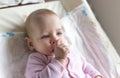 Portrait of a smiling baby laying on a changing table Royalty Free Stock Photo