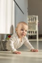 Portrait of a smiling baby laying on a changing table Royalty Free Stock Photo