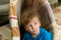 Portrait of smiling baby with standing hair from static electricity