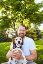 Portrait of smiling bearded man with his dog Royalty Free Stock Photo