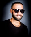 Portrait of smiling beared man with sunglasses