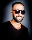 Portrait of smiling beared man with sunglasses Royalty Free Stock Photo