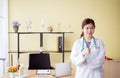 Portrait of smiling beautiful asian woman doctor showing thumps up sign at hospital,Happy and positive attitude Royalty Free Stock Photo