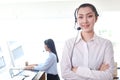 Portrait of smiling beautiful Asian woman with headphones work at call center service desk consultant, call center operator agent Royalty Free Stock Photo