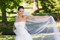 Portrait of a smiling beautiful bride in park Royalty Free Stock Photo