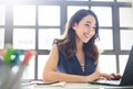 Portrait of smiling beautiful business asian woman with suit working in office deskÃ Â¹Æ