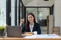 Portrait of smiling beautiful business asian woman with working in modern office desk using computer, Business people Royalty Free Stock Photo