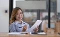 Portrait of smiling beautiful business asian woman with working in modern office desk using laptop computer, Business people Royalty Free Stock Photo
