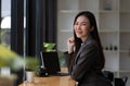 Portrait of smiling beautiful business asian woman working in modern office desk using tablet laptop computer, Business Royalty Free Stock Photo