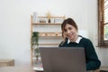 Portrait of smiling beautiful business asian young woman working in office use computer with copy space. Royalty Free Stock Photo