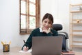 Portrait of smiling beautiful business asian young woman working in office use computer with copy space. Royalty Free Stock Photo