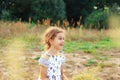 Portrait of smiling beautiful little girl at  the meadow at summer day Royalty Free Stock Photo