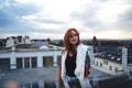 Portrait of smiling beautiful millennial girl standing on lookout terrace. Attractive young woman in jacket looking to Royalty Free Stock Photo