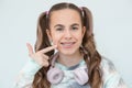 Portrait of smiling beautiful teenage girl with braces listening music in headphones, audiobook, lecture Royalty Free Stock Photo