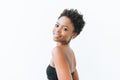 Portrait of smiling beautiful young African American woman in black top isolated on the white background Royalty Free Stock Photo