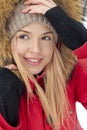 Portrait of smiling beautiful young girl in red jacket Royalty Free Stock Photo