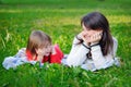 Portrait of smiling beautiful young woman and little daughter Royalty Free Stock Photo