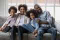 Portrait of smiling biracial family with kids relaxing Royalty Free Stock Photo