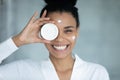 Portrait of smiling biracial woman recommend face cream Royalty Free Stock Photo