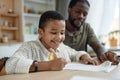 Boy Doing Homework with Father Royalty Free Stock Photo